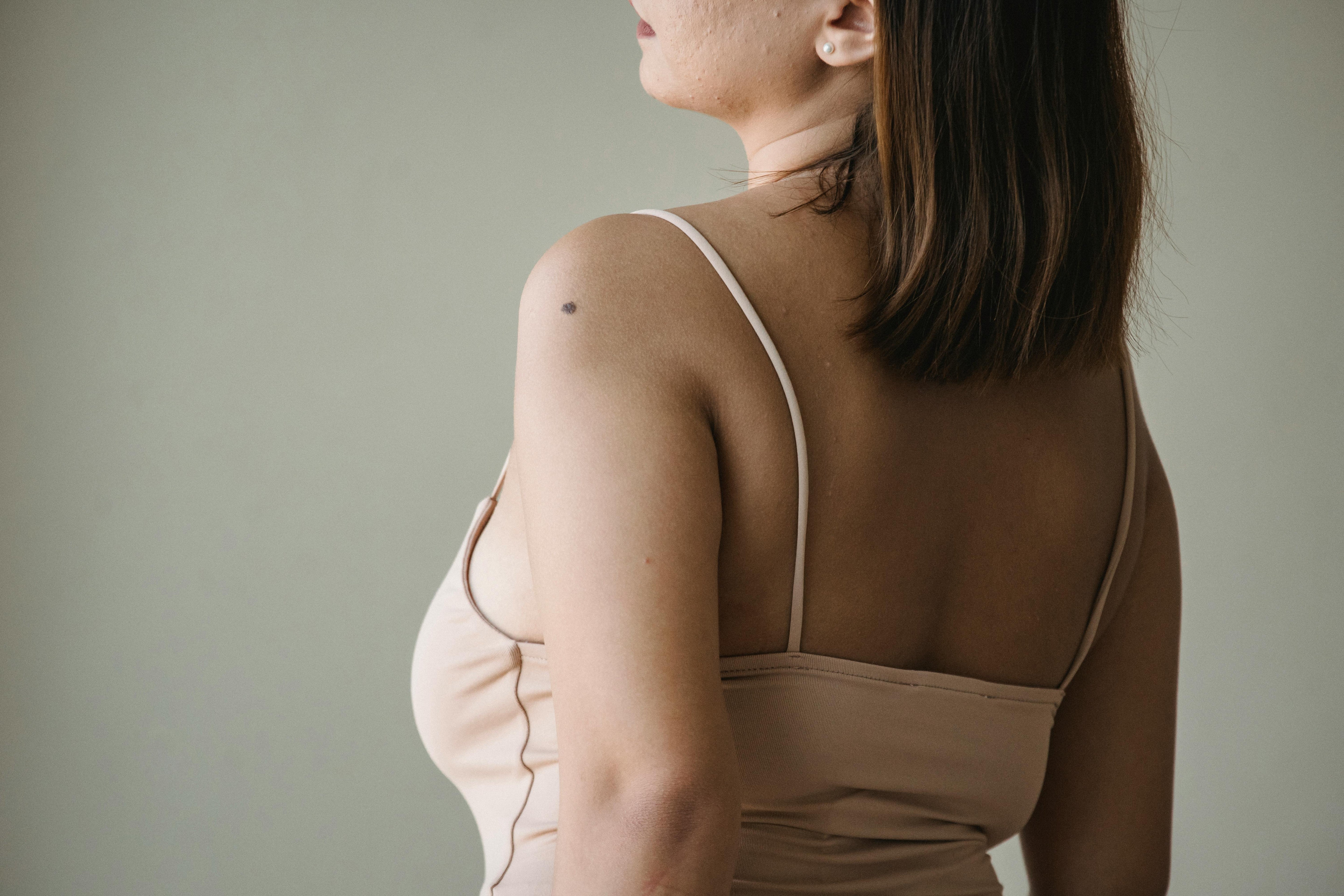 Woman in her 40s feeling empowered while managing perimenopause symptoms naturally