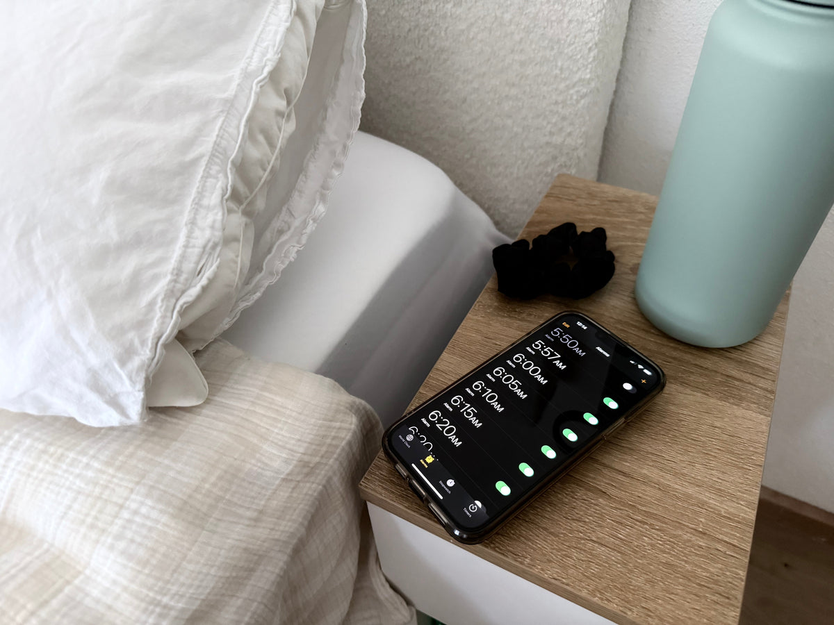 alarm clocks next to bed